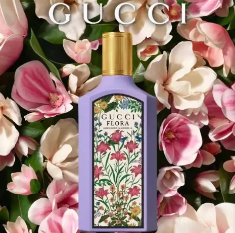Gucci Flora perfume among pink flowers